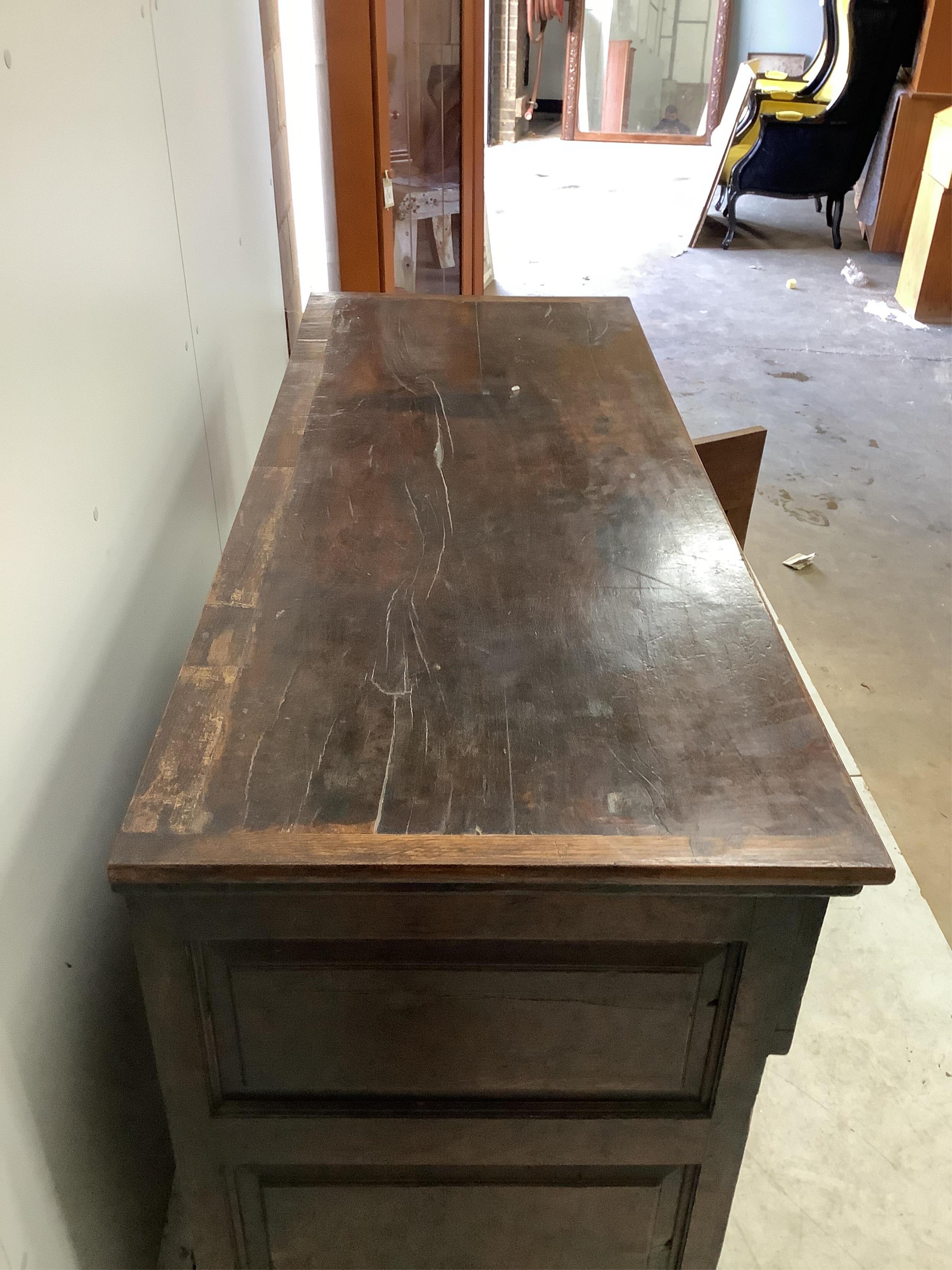 An 18th century oak low dresser, width 142cm, depth 55cm, height 88cm. Condition - fair